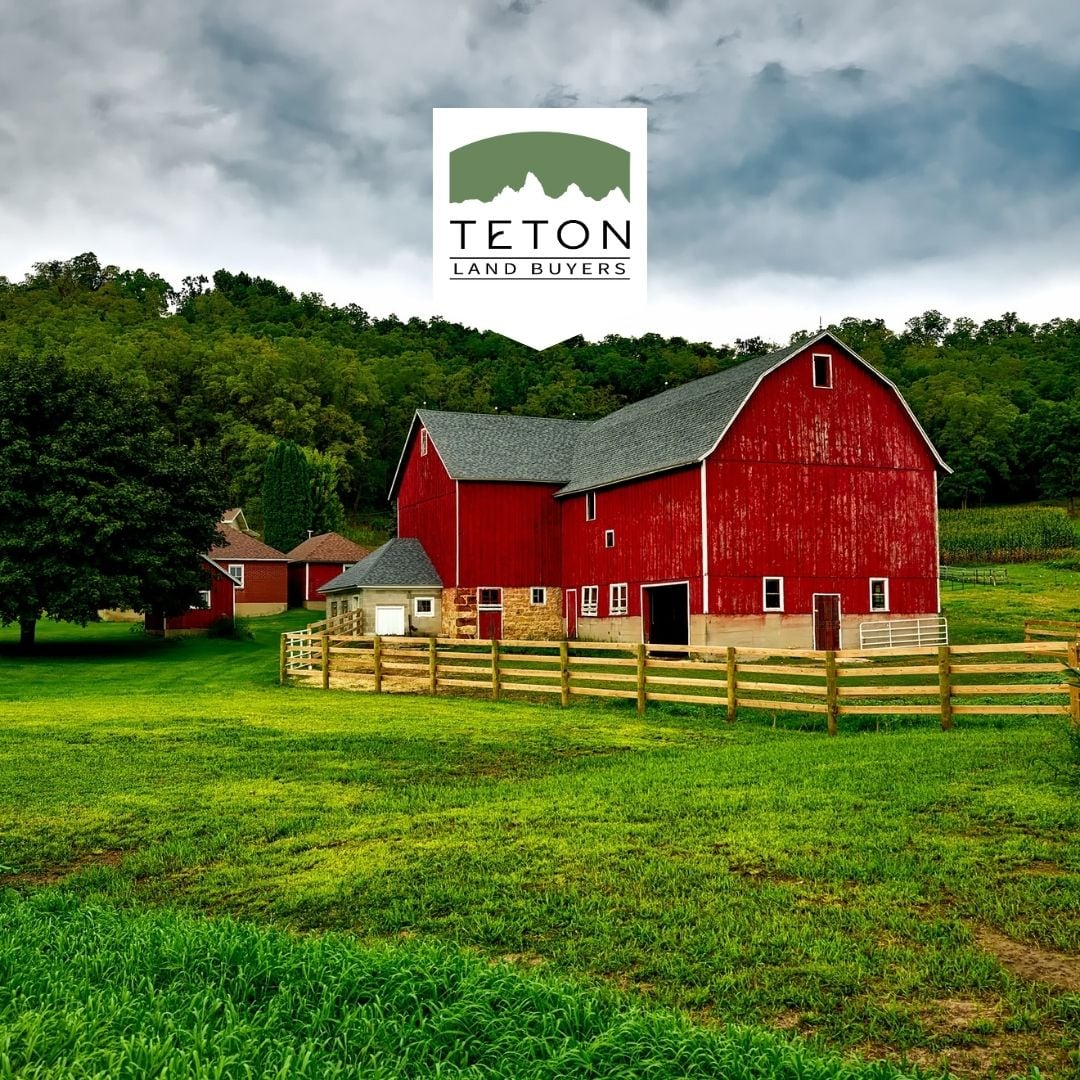 Red barn and fenced pasture on rural farmland
